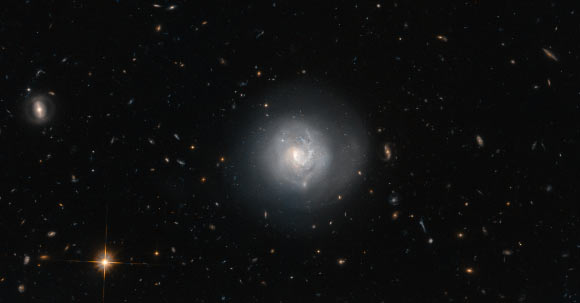 This Hubble image shows the lenticular galaxy Markarian 820. Image credit: NASA / ESA / Hubble / N. Gorin, STScI / Judy Schmidt, www.geckzilla.com.