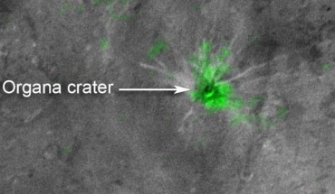 This composite image is based on observations from New Horizons’ Ralph/LEISA instrument made on July 14, when the spacecraft was 50,000 miles (81,000 km) from Charon. The data were downlinked October 1 - 4 and processed into a map of Charon’s 2.2 micron ammonia-ice absorption band (green color). Panchromatic images from New Horizons’ Long Range Reconnaissance Imager used as the background in this composite were taken on July 14 and downlinked October 5 – 6. Image credit: NASA / Johns Hopkins University Applied Physics Laboratory / Southwest Research Institute.