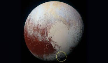 This high-resolution image of Pluto was taken by New Horizons on July 14, 2015: yellow circle shows location of Wright Mons and Piccard Mons mountains on the dwarf planet. Image credit: NASA / Johns Hopkins University Applied Physics Laboratory / Southwest Research Institute.