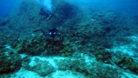 Archaeologists survey the scatter of a Late Roman shipwreck. Image credit: V. Mentogianis.