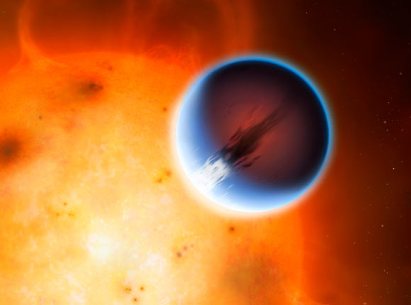 HD 189733b is shown here in front of its host star, HD 189733; a belt of wind around the equator of the planet travels at 5,400 mph from the heated day side to the night side. Image credit: Mark A. Garlick / University of Warwick.