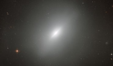 This dramatic image shows the Hubble’s view of a dynamically young lenticular galaxy known as NGC 3610, which lies 72 million light-years away. Image credit: NASA / ESA / Hubble / Judy Schmidt, www.geckzilla.com.