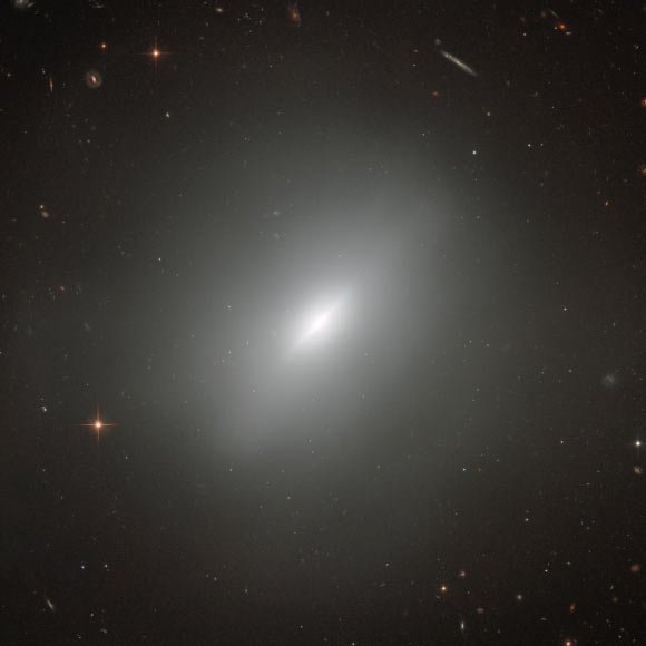 This dramatic image shows the Hubble’s view of a dynamically young lenticular galaxy known as NGC 3610, which lies 72 million light-years away. Image credit: NASA / ESA / Hubble / Judy Schmidt, www.geckzilla.com.