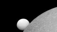 This image, taken with Cassini’s narrow-angle camera on September 8, shows Dione (near) and Enceladus (far). Although these moons are composed of nearly the same materials, Enceladus has a considerably higher reflectivity than Dione. This view looks toward the leading hemisphere of Enceladus. North on Enceladus is up and rotated 1 degree to the right. Image credit: NASA / JPL-Caltech / Space Science Institute.