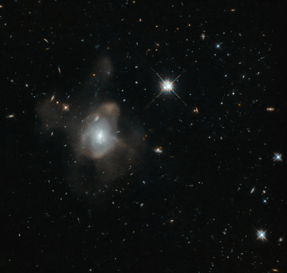 This wide-field image shows the galaxy LEDA 3087775 among the foreground stars. Image credit: NASA / ESA / Hubble / Judy Schmidt, www.geckzilla.com. 