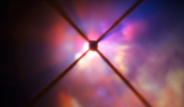 In this image from ESO’s Very Large Telescope (VLT) the red hypergiant star VY Canis Majoris is hidden behind an obscuring disc; the crosses are artifacts due to features in VLT’s SPHERE instrument. Image credit: ESO.