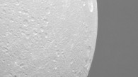 Dione in front of Saturn’s rings. This view, acquired by NASA’s Cassini spacecraft during a close flyby of the icy moon on August 17, is centered on terrain at 7 degrees south latitude, 122 degrees west longitude. Image credit: NASA / JPL-Caltech / Space Science Institute.