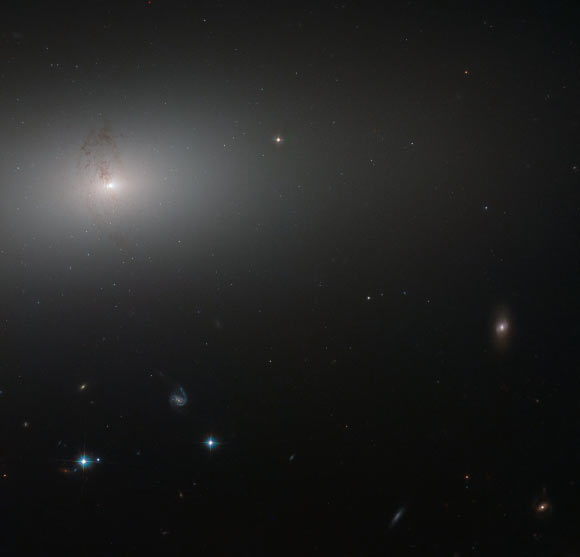 This Hubble image shows the elliptical galaxy NGC 2768 (upper left). Image credit: NASA / ESA / Hubble / S. Smartt, Queen’s University Belfast.
