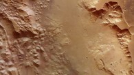 This image focuses on a section of Aurorae Chaos on Mars. Vast volumes of water once flooded through this deep chasm on the planet that connects Valles Marineris to the planet’s northern lowlands. The image was taken by Mars Express’ High Resolution Stereo Camera on July 16, 2015. The image was acquired using the nadir channel of the camera, which is directed vertically down onto the surface of Mars. Image credit: ESA / DLR / FU Berlin / CC BY-SA 3.0 IGO.