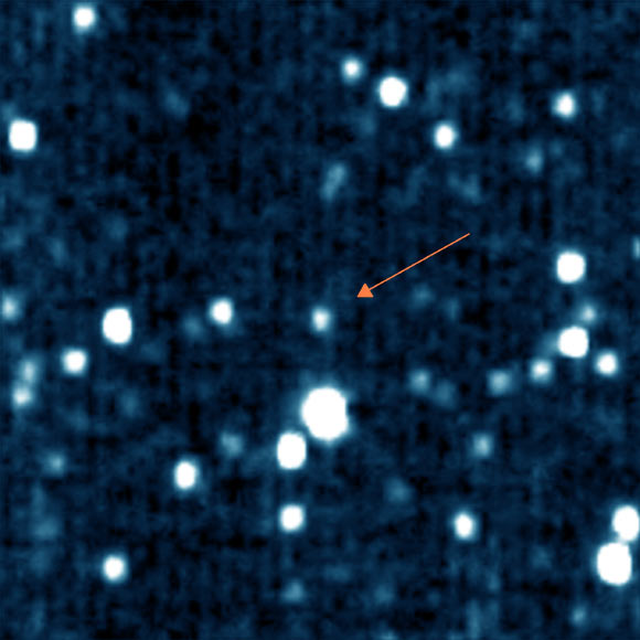 This false color image shows the minor planet/plutino 1994 JR1 (arrow). Image credit: NASA / Johns Hopkins University Applied Physics Laboratory / Southwest Research Institute.