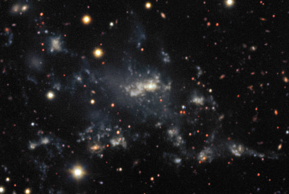 This image from ESO’s Very Large Telescope shows the dwarf galaxy NGC 5291N (center). Image credit: ESO.