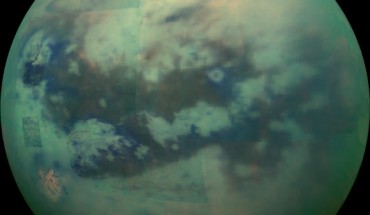 This composite image shows an infrared view of Titan. In this image blue represents wavelengths centered at 1.3 microns, green represents 2.0 microns, and red represents 5.0 microns. A view at visible wavelengths would show only Titan’s hazy atmosphere; the near-infrared wavelengths in this image allow Cassini’s vision to penetrate the haze and reveal the moon’s surface. The view looks toward terrain that is mostly on the Saturn-facing hemisphere of Titan. Image credit: NASA / JPL-Caltech / Space Science Institute.