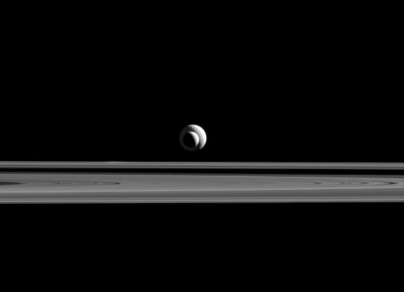 The Saturn moons Tethys (far) and Enceladus (near) appear together in this image taken by the narrow-angle camera aboard NASA’s Cassini spacecraft on September 24, 2015. Image credit: NASA / JPL-Caltech / Space Science Institute. 