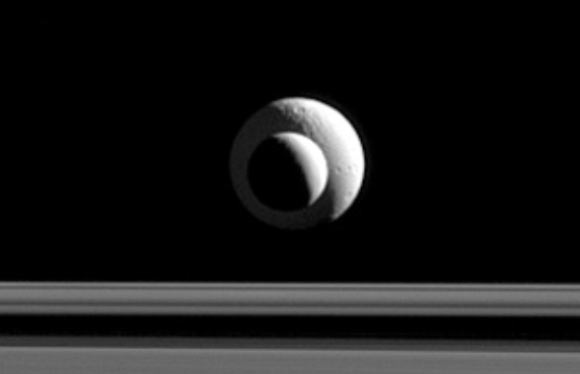 Like a cosmic bull’s-eye, the two Saturnian moons line up almost perfectly for Cassini’s narrow-angle camera. Image credit: NASA / JPL-Caltech / Space Science Institute.