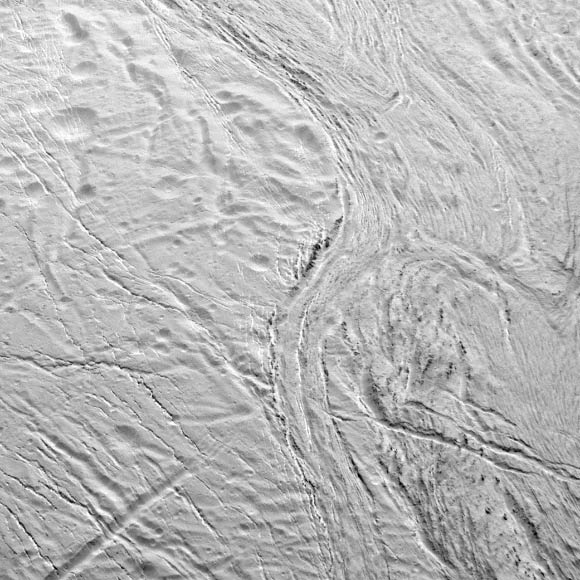 On December 19, 2015, Cassini captured this view featuring the nearly parallel furrows and ridges of the feature named Samarkand Sulci. The image was taken with the narrow-angle camera onboard Cassini. The view was acquired at a distance of 8,000 miles (12,000 km) from Enceladus. Image credit: NASA / JPL-Caltech / Space Science Institute.