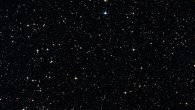 This wide-field image shows the patch of sky around the distant quasar PKS 1939-315 (green cross). Image credit: Centre de Données astronomiques de Strasbourg / SIMBAD.