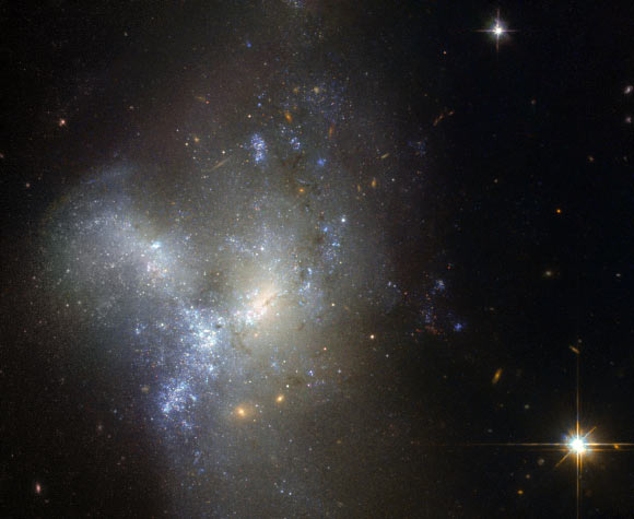 NGC 1487, pictured in this Hubble WFPC2 image, is the result of a merger between two or more smaller galaxies. Image credit: NASA / ESA / Hubble / Judy Schmidt, www.geckzilla.com.