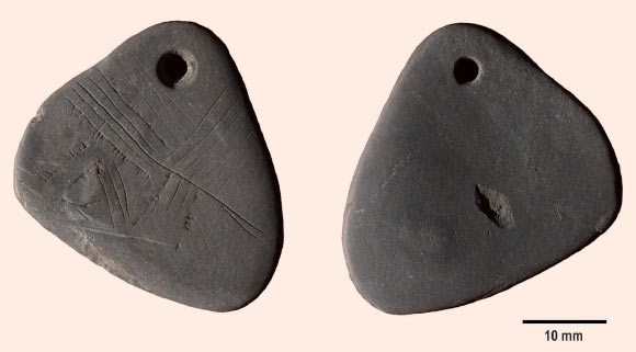 11,000-year-old engraved shale pendant. Image credit: Milner, N. et al. / Internet Archaeology, doi: 10.11141/ia.40.8.