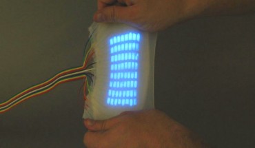 Multi-pixel electroluminescent displays fabricated via replica molding; the device measures 5 mm thick, with each of the 64 pixels measuring 4 mm; it can be deformed and stretched in various ways. Image credit: Organic Robotics Lab at Cornell University.