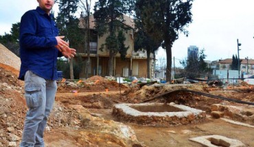 Dr. Wiegmann views a 1,600-year-old winepress uncovered in Jerusalem. Image credit: Israel Antiquities Authority.