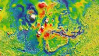 This view of the Martian gravity map shows the Tharsis volcanoes and surrounding flexure: the white areas in the center are higher-gravity regions produced by the massive Tharsis volcanoes, and the surrounding blue areas are lower-gravity regions that may be cracks in the crust. Image credit: MIT / UMBC-CRESST / GSFC.