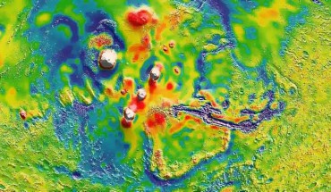 This view of the Martian gravity map shows the Tharsis volcanoes and surrounding flexure: the white areas in the center are higher-gravity regions produced by the massive Tharsis volcanoes, and the surrounding blue areas are lower-gravity regions that may be cracks in the crust. Image credit: MIT / UMBC-CRESST / GSFC.