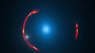 Composite image of the gravitational lens SDP.81 showing the distorted ALMA image of the more distant galaxy (red arcs) and the Hubble optical image of the nearby lensing galaxy (blue center object). By analyzing the distortions in the ring, astronomers have determined that a dark dwarf galaxy (data indicated by white dot near left lower arc segment) is lurking nearly 4 billion light-years away. Image credit: Y. Hezaveh, Stanford University / ALMA / NRAO / ESO / NAOJ / NASA / ESA / Hubble Space Telescope.