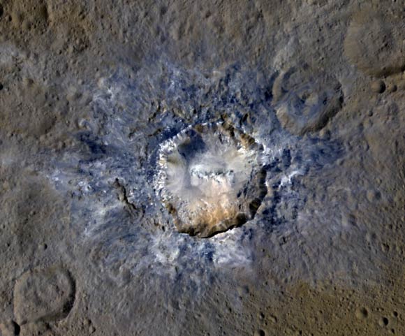 The bluish material visible in this enhanced-color image of Haulani Crater indicates relatively fresh material on the surface. Image credit: NASA / JPL-Caltech / UCLA / MPS / DLR / IDA / PSI.