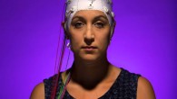 A woman wearing an EEG headset. Image credit: Jonathan Cohen / Binghamton University.