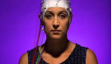 A woman wearing an EEG headset. Image credit: Jonathan Cohen / Binghamton University.