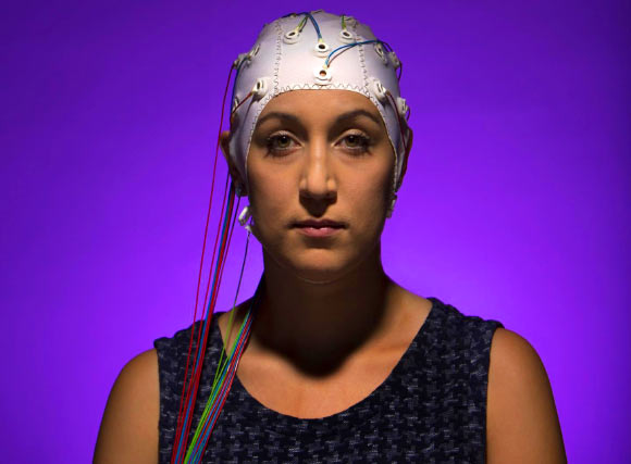 A woman wearing an EEG headset. Image credit: Jonathan Cohen / Binghamton University.
