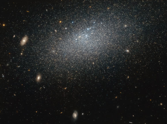 The drizzle of stars scattered across this Hubble image forms a nearby irregular dwarf galaxy known as UGC 4879. Image credit: NASA / ESA.