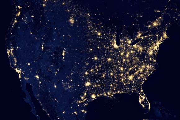 This image of the continental United States at night is a composite assembled from data acquired by the Suomi NPP satellite in April and October 2012. The image was made possible by the satellite's ‘day-night band’ of the Visible Infrared Imaging Radiometer Suite (VIIRS), which detects light in a range of wavelengths from green to near-infrared and uses filtering techniques to observe dim signals such as city lights, gas flares, auroras, wildfires and reflected moonlight. Image credit: NASA Earth Observatory / NOAA NGDC.