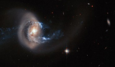A Hubble image of the spiral galaxy NGC 7714, which has been dramatically distorted in shape by a close interaction with another nearby galaxy. Minor, but frequent, disturbances such as this cause a burst of star formation, accounting for around half of all new stars being formed in the local Universe. Image credit: NASA / ESA / A. Gal-Yam, Weizmann Institute of Science.