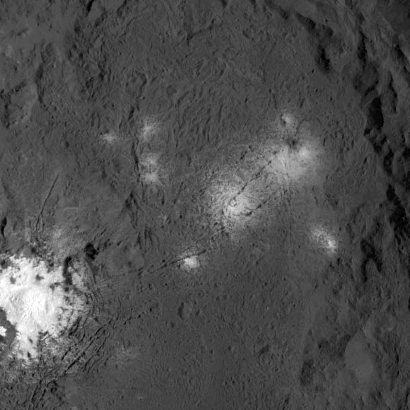 Ceres’ bright spots are seen up close in this image from NASA’s Dawn spacecraft. The probe took this image on March 26, 2016, from its low-altitude mapping orbit, at a distance of about 240 miles (385 km) above the surface. Image credit: NASA / JPL-Caltech / UCLA / MPS / DLR / IDA.