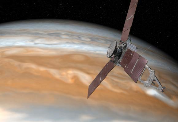 This artist’s rendering shows Juno making one of its close passes over Jupiter. Image credit: NASA / JPL-Caltech.