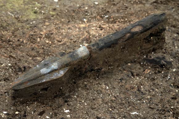 Bronze spear found in situ. Image credit: Dave Webb / Cambridge Archaeological Unit.