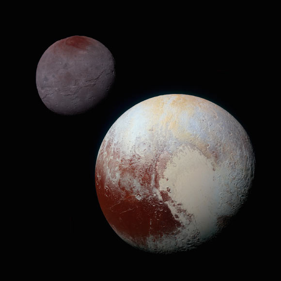 This composite image shows Pluto (lower right) and Charon (upper left). The image combines blue, red and infrared images taken by the spacecraft’s Ralph/Multispectral Visual Imaging Camera. Image credit: NASA / Johns Hopkins University Applied Physics Laboratory / Southwest Research Institute.