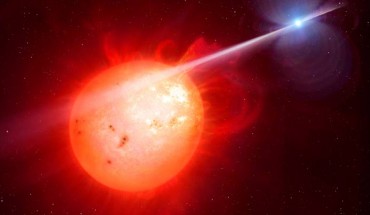 This artist’s impression shows AR Scorpii. In this unique double star a rapidly spinning white dwarf star (right) powers electrons up to almost the speed of light. These high energy particles release blasts of radiation that lash the companion red dwarf star (left) and cause the entire system to pulse dramatically every 1.97 minutes with radiation ranging from the ultraviolet to radio. Image credit: M. Garlick / University of Warwick / ESO.