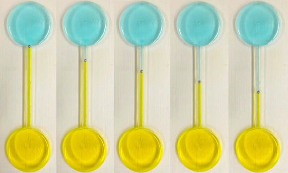 Continuous motion of a self-propelling droplet of Galinstan under a pH gradient, shown at different time intervals. The droplet is placed in a fluidic channel, midway between two reservoirs filled with different electrolytes of acidic and basic nature. Image credit: RMIT University.