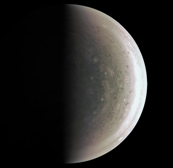 This Juno image provides a never-before-seen perspective on Jupiter’s south pole. JunoCam acquired the view on August 27, when the spacecraft was about 58,700 miles (94,500 km) above the polar region. At this point, the spacecraft was about an hour past its closest approach, and fine detail in the south polar region is clearly resolved. Unlike the equatorial region’s familiar structure of belts and zones, the poles are mottled by clockwise and counterclockwise rotating storms of various sizes, similar to giant versions of terrestrial hurricanes. The south pole has never been seen from this viewpoint, although the Cassini spacecraft was able to observe most of the polar region at highly oblique angles as it flew past Jupiter on its way to Saturn in 2000. Image credit: NASA / JPL-Caltech / SwRI / MSSS.