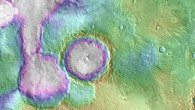 Valleys younger than better-known ancient valley networks on Mars are evident on the landscape in the northern Arabia Terra region, particularly in the area mapped here with color-coded topographical information overlaid onto a photo mosaic. The area includes a basin informally named ‘Heart Lake’ at upper left. Data from NASA’s Mars Global Surveyor orbiter are coded here as white and purple for lower elevations, yellow for higher elevation. The elevation information is combined with a mosaic of images from NASA’s Mars Odyssey orbiter, covering an area about 120 miles (about 190 km) wide. The mapped area is centered near 35.91 degrees north latitude, 1 degree east longitude on Mars. Image credit: NASA / JPL-Caltech / ASU.