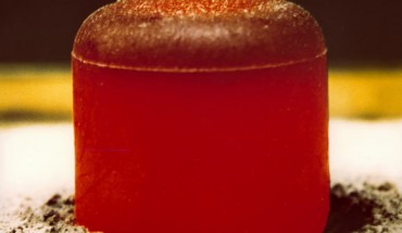 This image shows a pellet of plutonium-238 dioxide. The pellet is glowing red because of the heat generated by the radioactive decay (primarily alpha) of the fuel. Such pellets were used in radioisotope thermoelectric generators that powered NASA’s Galilleo and Cassini spacecraft on missions to Jupiter and Saturn, respectively. Image credit: Los Alamos National Laboratory.