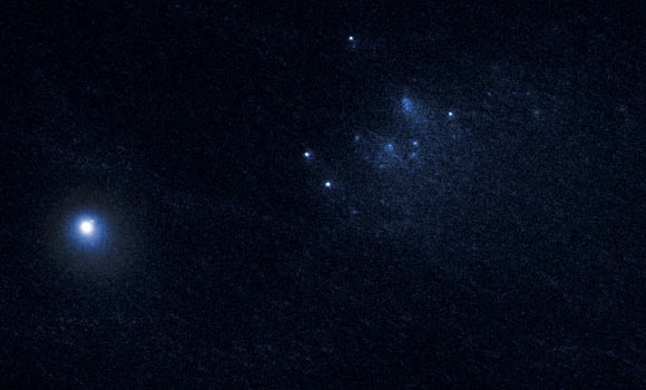 This image captured by Hubble’s Wide Field Camera 3 shows a dust-bathed cluster of fragments receding from the main nucleus of Comet 332P/Ikeya-Murakami at speeds in the range of 0.06 - 3.5 m/s. The nucleus of the comet is the bright object at lower left. This observation was made on January 27, 2016. Image credit: NASA / ESA / D. Jewitt, University of California at Los Angeles.