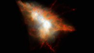 This image shows the Lyman-alpha blob LAB-1. This picture is a composite of two different images taken with the FORS instrument on ESO’s Very Large Telescope - a wider image showing the surrounding galaxies and a much deeper observation of the blob itself at the center made to detect its polarization. The intense Lyman-alpha ultraviolet radiation from LAB-1 appears green after it has been stretched by the expansion of the Universe during its long journey to Earth. These new observations show for the first time that the light from this object is polarized. This means that the giant ‘blob’ must be powered by galaxies embedded within the cloud. Image credit: M. Hayes / ESO.