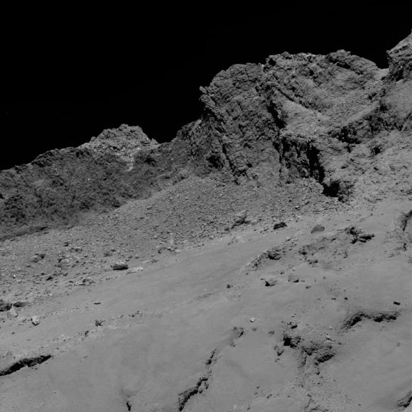 Rosetta’s OSIRIS narrow-angle camera captured this image of Comet 67P/Churyumov-Gerasimenko at 1:20 a.m. GMT from an altitude of about 16 km (9.9 miles) above the surface during the spacecraft’s final descent on September 30, 2016. Image credit: ESA / Rosetta / MPS / OSIRIS Team / UPD / LAM / IAA / SSO / INTA / UPM / DASP / IDA.