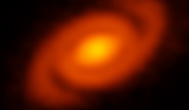ALMA peered into the Ophiuchus star-forming region to study the protoplanetary disk around Elias 2-27. Image credit: L. Pérez / B. Saxton / MPIfR / NRAO / AUI / NSF / ALMA / ESO / NAOJ / NASA / JPL Caltech / WISE Team.