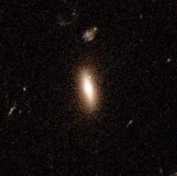 This Hubble image shows the lenticular galaxy GJ1417+52. Image credit: NASA / ESA / Hubble.