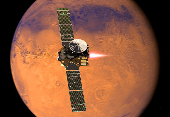 Artist’s impression visualizing the ExoMars 2016 Trace Gas Orbiter, with its thrusters firing, beginning its entry into Mars orbit on October 19, 2016. Image credit: ESA / ATG Medialab.