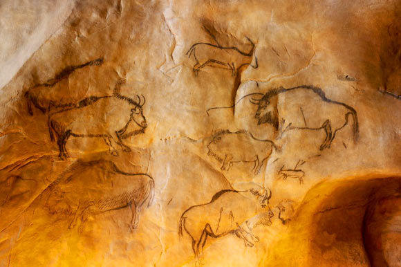 Charcoal drawings of bison in the Cave of Niaux, Tarascon-sur-Ariege, France. Image credit: D. Viet.